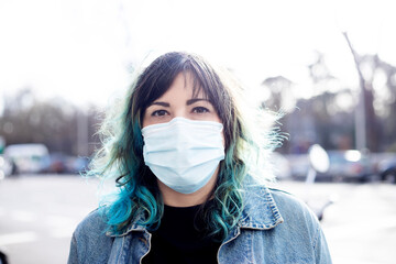 woman with mask.portrait of latina woman with surgical mask on location