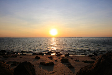 Natural sun set or sunrise over the sea , Sunset on blue ocean, The coast of Bangsean Chonburi, Thailand