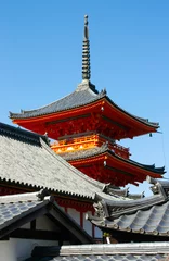 Zelfklevend Fotobehang A tower at the red colored Nishimon Temple at Kiyomizudera Temple in Kyoto in Japan © Tomas