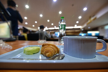 Meeting break food set on a table with blur people background in a meeting room