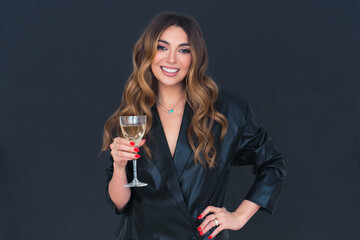 Beautiful young woman leather jacket hold glass of champagne and smile - Powered by Adobe