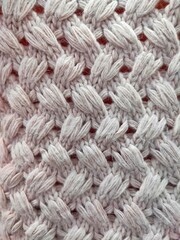 background and texture of woolen knitted fabric. sweater pattern.