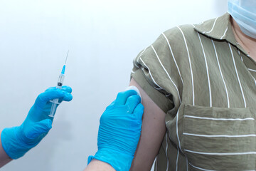 Man vaccinates against disease, syringe