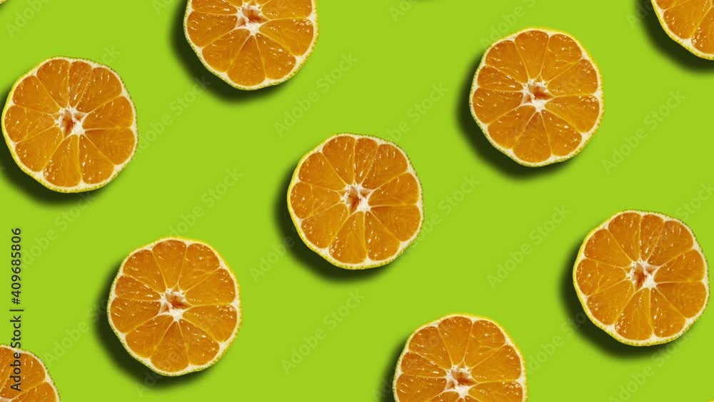 Poster pattern with mandarins in geometric grid on a green background. minimal seamless motion graphics nat