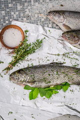 Preparing fresh trout for grill in garden