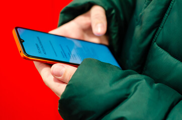 mobile phone in  hands of  person. Modern means of communication.