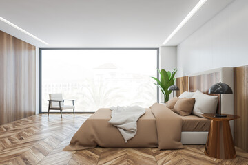 Wooden bedroom, bed with linens on parquet floor and window