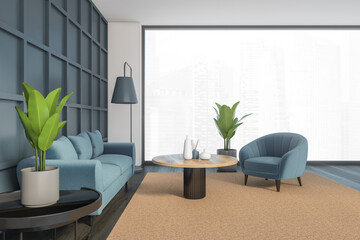 Blue and white living room with sofa and armchair on carpet