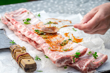 Closeup of preparing ribs for grilling in summer