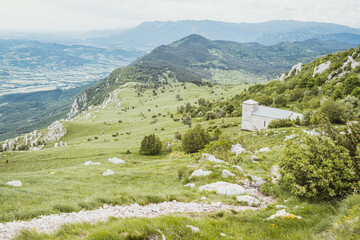 Beautiful landscape view on hiking trail in the Alps. View over Vipava valley in late summer afternoon. Summer on Nanos mountain. © Glyph_stock