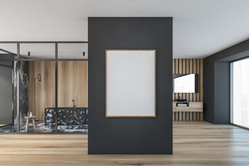 Interior of modern bathroom with white poster, grey marble floor and wooden walls, sink with large mirror above it and black bathtub. Vertical mock up banner frame. 3d rendering