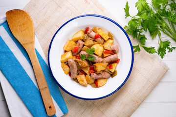 Chicken cooked with vegetables and potatoes.