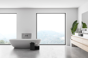 Interior of stylish bathroom with concrete floor, comfortable white bathtub, double sink with horizontal mirror and panoramic windows. 3d rendering