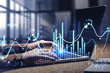 Businesswoman hands or stock trader analyzing stock graph chart by fibonacci indicator using laptop...
