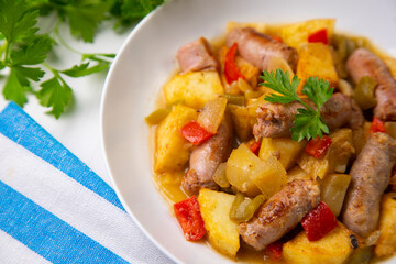 Salchichas stew with potatoes and paprika
