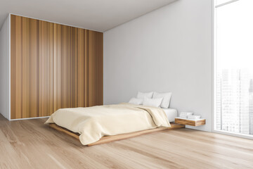 Beige bedroom, bed with linens and wooden wardrobe on parquet floor