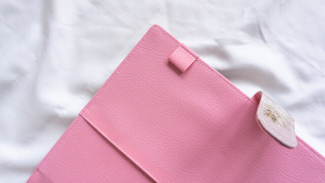 Closeup Shot Of A Pink Tablet Case On A White Fabric