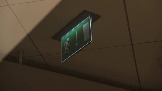 Flashing green emergency exit sign. 