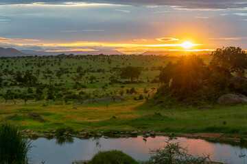 Beautiful and dramatic african landscape, sunset in Serengeti