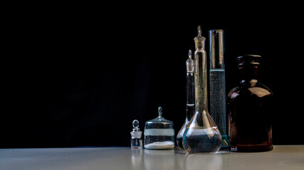 Fototapeta na wymiar medical laboratory glass and flasks on black background