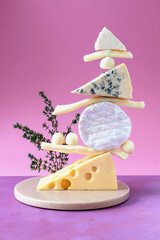 Gastronomy concept with gourmet cheeses. Nutrition trend. Equilibrium floating food balance.