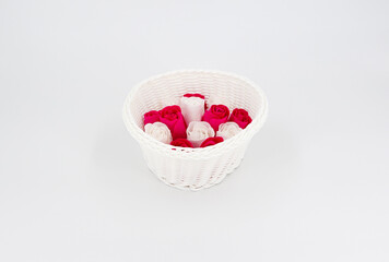 White wicker vase with roses