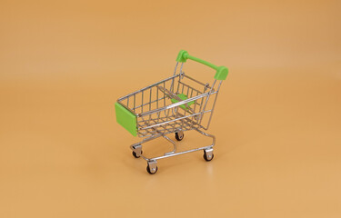 Shopping cart isolated on orange background