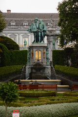 Brussels (Bruxelles), Belgium. Statue of Counts Egmont and Hornes overlooking a fountain on the square Petit Sablon