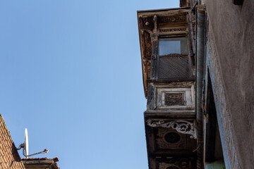 Wooden and stone houses with bay windows in historical basmane streets