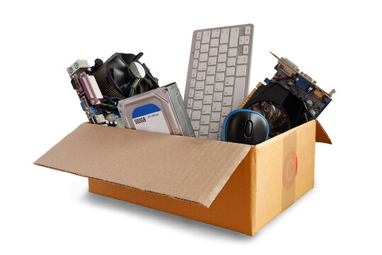 Hard disks and motherboards and old computer hardware accessories, Electronic waste in paper boxes isolated on white background, Reuse and Recycle concept.