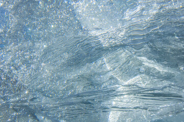 Waves, patterns, air, frozen water in nature. Abstract ice drawing.