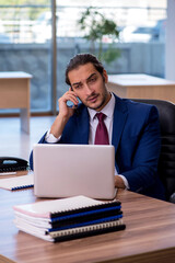 Young businessman employee working in the office