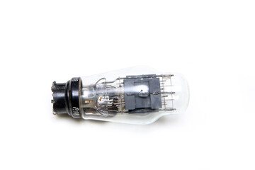 The single vacuum or electron tube isolated on a white background. The obsolete electronic device for current control. 