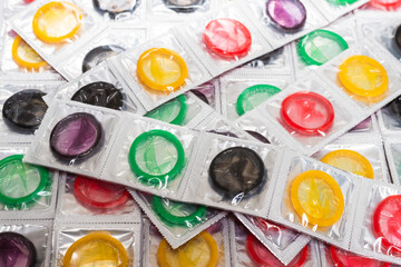 Colorful condoms background.