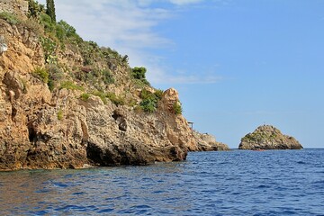 blue sea water, rocks, a cave carved in the rock, a cave in the rocks by the sea, a blue cave in...