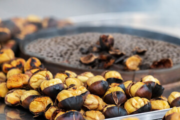 Roasted chestnuts. Street food. Shallow depth of field.