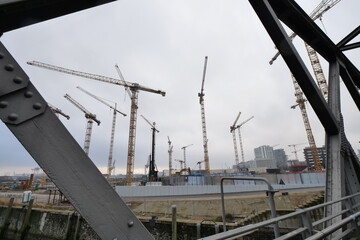 Fototapeta premium Construction Site in Hamburg, Germany with a lot of massive cranes