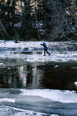 A cold Sunday in January on the frozen local lake or river in just outside of Oslo city. Norwegian families are gathering on the ice for skating and having fun.