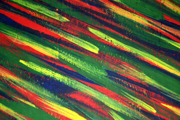 Background from different strokes of red, yellow, green and blue paint