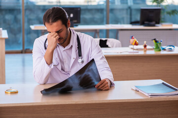 Young male doctor radiologist working in the clinic