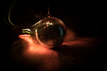 Colorful disco mirror ball lights night club background. Party lights disco ball. Selective focus