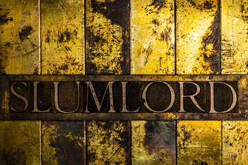Slumlord text on vintage textured grunge copper and gold background