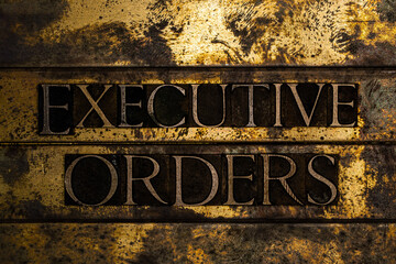 Executive Orders on grunge textured copper and gold steampunk style background