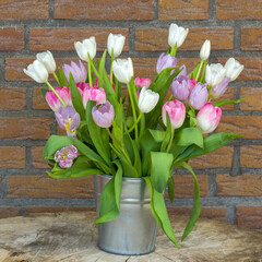 colourful tulips in a bucket