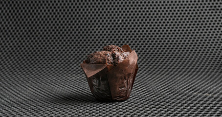 simple black chocolate muffin, dessert traditional food, abstract isolated object on the color background