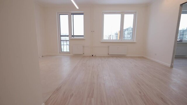 Moving in new apartment white flat interior, view of empty rooms new home construction.