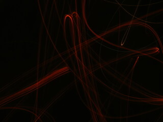 Orange, red, flame, fire abstract Neon light lines on black background