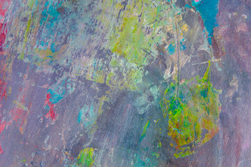 colorful creative motley background: smudged residues of oil paints on a wooden palette, short focus, selective blur