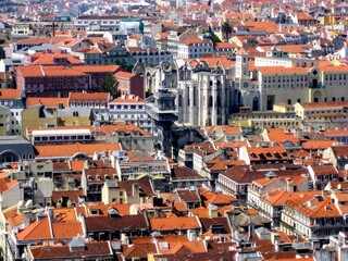 Fototapeta na wymiar Aerial view of Lisbon Baixa district with Santa Justa Lift (Carmo Lift) and ruins of historical Gothic church Convent of Our Lady of Mount Carmel (Igreja do Carmo), destroyed by earthquake in 1755. 