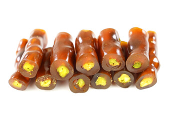 Traditional Turkish sweet,  raisin sausage with pistachio nuts,   . Isolated on white background.
